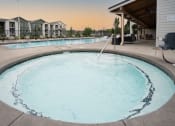 Thumbnail 23 of 27 - a large resort style swimming pool with a building in the background at Sonder Fields in Happy Valley, OR