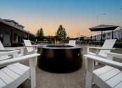 Thumbnail 25 of 27 - a round fire pit with white chairs around it at Sonder Fields in Happy Valley, OR