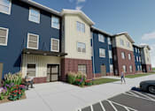 Thumbnail 1 of 115 - A blue building with a woman walking in front.