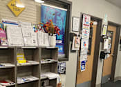 Thumbnail 105 of 115 - A hallway with a sign that says "E AWESOME TODAY" on the wall.