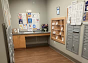 Thumbnail 103 of 115 - A room with a wooden floor and a whiteboard on the wall.