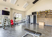 Thumbnail 17 of 26 - Fitness Center with cardio machines and strength training equipment at Bucking Horse Apartments, Fort Collins, CO, 80525