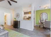 Thumbnail 3 of 27 - Living Room With Dining Area at Reserve at Bridford, Greensboro, NC