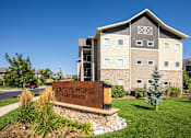 Thumbnail 1 of 26 - Apartment building and sign for Bucking Horse apartments at Bucking Horse Apartments, Fort Collins