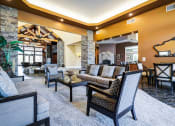 Thumbnail 19 of 30 - a living room with couches and chairs and a fireplace at Madison Sierra Sun, Puyallup