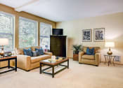 Thumbnail 6 of 30 - a living room with couches and chairs and a television at Madison Sierra Sun, Puyallup, Washington