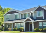 Thumbnail 28 of 30 - a gray house with a yard in front of it at Madison Sierra Sun, Puyallup, 98374