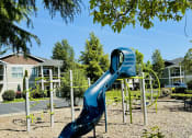 Thumbnail 30 of 30 - a slide at a playground in a park at Madison Sierra Sun, Puyallup