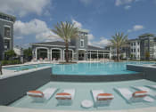 Thumbnail 2 of 33 - Pool with in-water seating and sun lounge  at The Parkway on Westlake, Texas, 77346