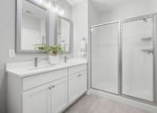 Thumbnail 81 of 124 - A bathroom with a white sink and a mirror above it at Madison Prickett Preserve, Yardley, PA