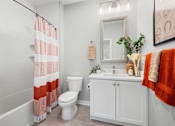 Thumbnail 86 of 124 - a bathroom with a shower and a toilet and a sink at Madison Prickett Preserve, Yardley