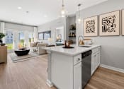 Thumbnail 71 of 124 - A modern kitchen with a large island and a view of the outdoors at Madison Prickett Preserve, Pennsylvania