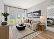 Thumbnail 75 of 124 - A modern living room with a large window and a view of a building outside at Madison Prickett Preserve, Pennsylvania