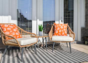 Thumbnail 88 of 124 - Two chairs with orange cushions are on a striped rug at Madison Prickett Preserve, Pennsylvania, 19067