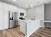 Thumbnail 90 of 124 - a large white kitchen with a stainless steel refrigerator at Madison Prickett Preserve, Pennsylvania