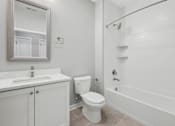 Thumbnail 106 of 124 - A white bathroom with a toilet, sink, and bathtub at Madison Prickett Preserve, Yardley