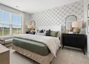 Thumbnail 78 of 124 - A bedroom with a large bed, a nightstand, and a window with blinds at Madison Prickett Preserve, Yardley Pennsylvania