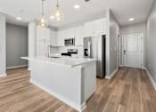 Thumbnail 100 of 124 - A kitchen with a white island and wooden floors at Madison Prickett Preserve, Yardley Pennsylvania