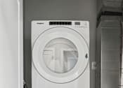 Thumbnail 98 of 124 - A white washing machine and dryer stacked on top of each other in a laundry room at Madison Prickett Preserve, Yardley Pennsylvania