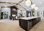 Thumbnail 2 of 124 - A modern kitchen with a large island and a dining area with a table and chairs at Madison Prickett Preserve, Yardley Pennsylvania