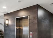 Thumbnail 19 of 124 - A stainless steel elevator with a red emergency stop button at Madison Prickett Preserve, Yardley Pennsylvania
