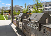 Thumbnail 52 of 124 - two bbq grills on a stone wall in front of a building at Madison Prickett Preserve, Yardley