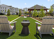 Thumbnail 59 of 124 - a patio with lounge chairs and a fire pit at Madison Prickett Preserve, Yardley, PA