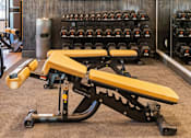 Thumbnail 27 of 124 - a workout room with weights and a tv on the wall at Madison Prickett Preserve, Yardley, 19067