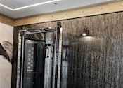 Thumbnail 30 of 124 - A gym with a wooden floor and a wall-mounted fan at Madison Prickett Preserve, Pennsylvania