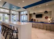 Thumbnail 19 of 33 - the lobby of a restaurant with a bar and stools  at The Parkway on Westlake, Humble
