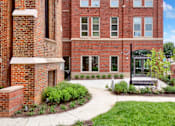 Thumbnail 3 of 17 - Beautifully landscaped courtyard at Highland Terrace apartments located in Richmond's Highland Park neighborhood