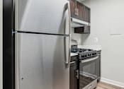 Thumbnail 5 of 15 - Modern, energy-efficient kitchens with stainless steel appliances at Park Montgomery apartments located along the Purple Line in Silver Spring, MD.