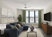 Thumbnail 2 of 33 - A living room with a blue couch and a flat screen TV mounted on the wall.