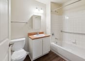 Thumbnail 15 of 17 - a bathroom with a toilet sink and bathtub