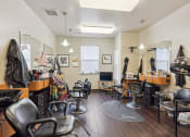 Thumbnail 4 of 17 - a salon room with chairs and mirrors