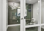 Thumbnail 6 of 23 - A glass door with a white frame and a sign that says "CONFIDENTIAL" on it.