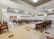 Thumbnail 5 of 17 - a large dining room with a large table and chairs