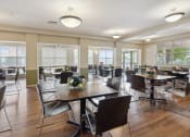 Thumbnail 6 of 17 - a large dining room with tables and chairs
