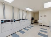 Thumbnail 10 of 17 - a room filled with washers and dryers