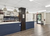 Thumbnail 60 of 75 - A kitchen with a blue counter and a white ceiling.