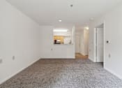 Thumbnail 11 of 18 - a bedroom with white walls and carpet