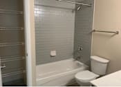 Thumbnail 7 of 14 - Bath and linen storage at Randle Hill affordable apartment community located in Washington, DC