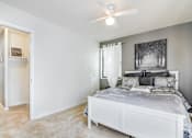 Thumbnail 8 of 19 - Comfortable bedroom with generous space, bright windows, and neutral tones at Meadowbrook Run, ideal for creating a restful personal retreat in Southeast Washington, D.C.