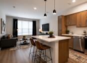 Thumbnail 25 of 25 - A modern kitchen with a large island and stainless steel appliances.