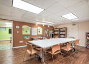 Thumbnail 13 of 19 - Inviting community room at Meadowbrook Run Apartments designed for resident gatherings and social events, with comfortable seating and open layout.