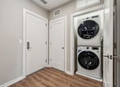 Thumbnail 10 of 17 - A white door with a black handle is on the left side of the image.