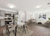 Thumbnail 17 of 22 - A modern kitchen with a glass table and grey chairs.