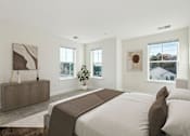 Thumbnail 19 of 22 - A bedroom with a large bed and a wooden cabinet.