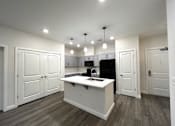 Thumbnail 16 of 17 - Smart, stylish kitchen with convenient in-home washer/dryer at Highland Terrace apartments located in Richmond's Highland Park neighborhood