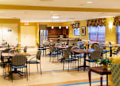Thumbnail 4 of 14 - Spacious community room at Park View at Colonial Landing where senior residents gather for coffee, activities, and social events in a friendly, supportive environment.